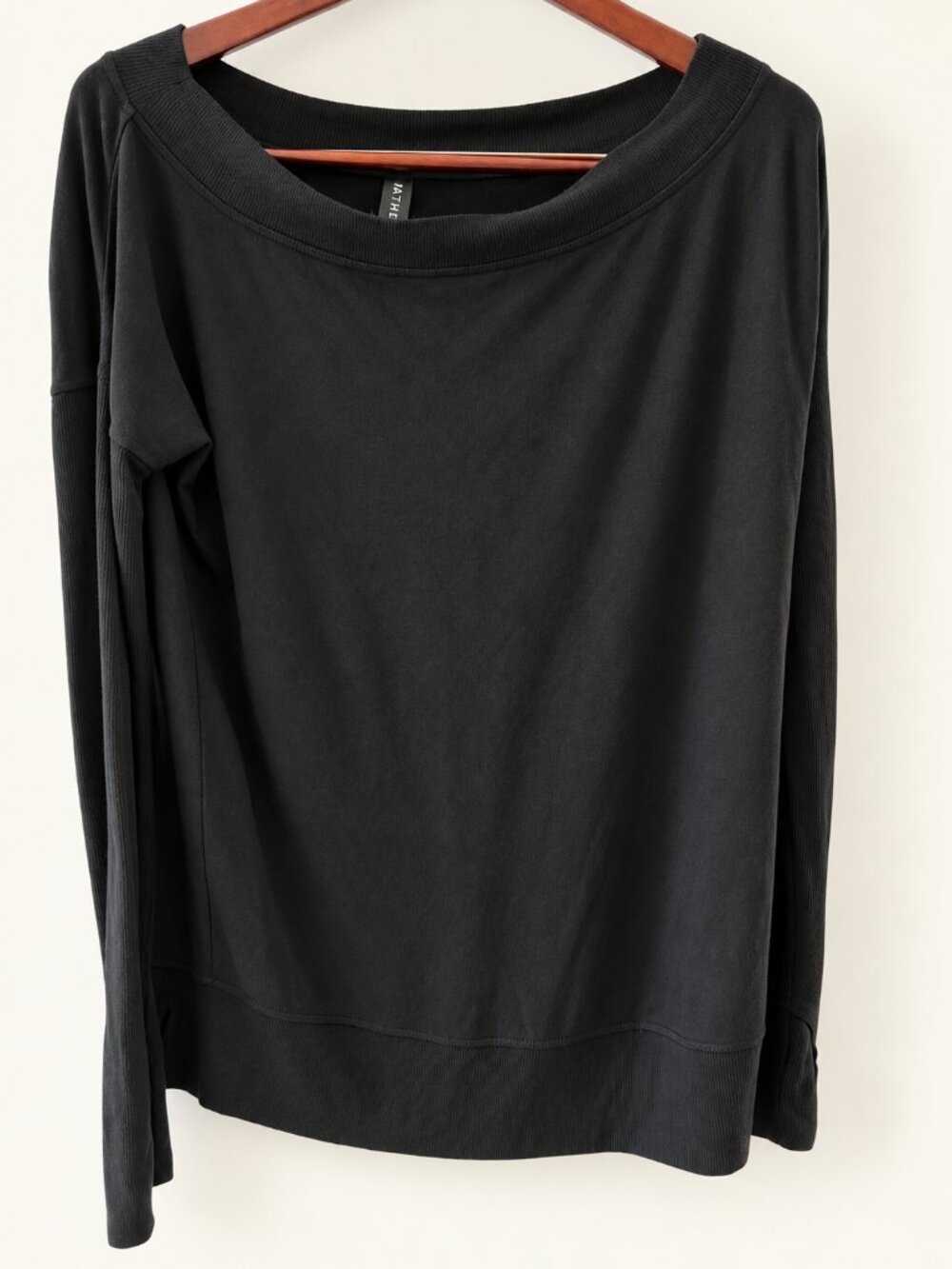 Athleta black long-sleeve boatneck pullover in women’s size Medium